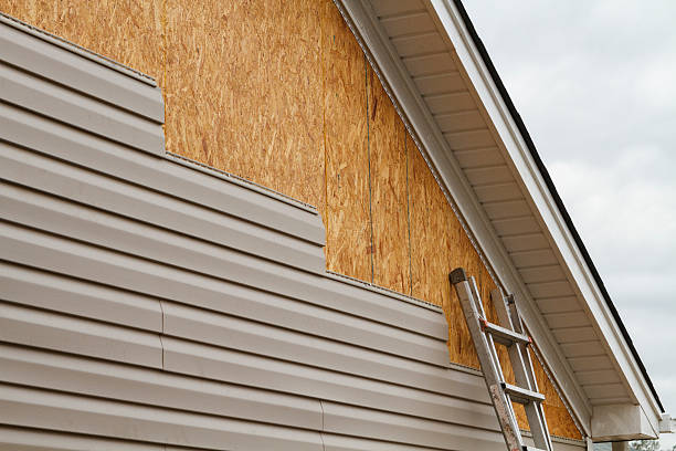 Professional Storm Damage Siding Repair technician working in Marietta, OH